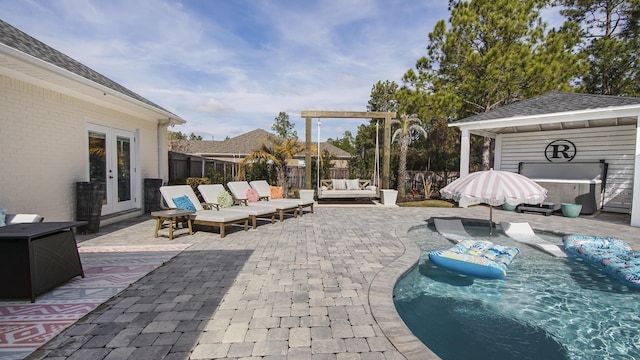 view of patio featuring french doors, outdoor lounge area, and a pool with hot tub