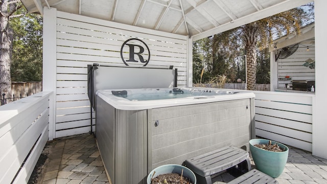 view of patio / terrace featuring a gazebo and a hot tub