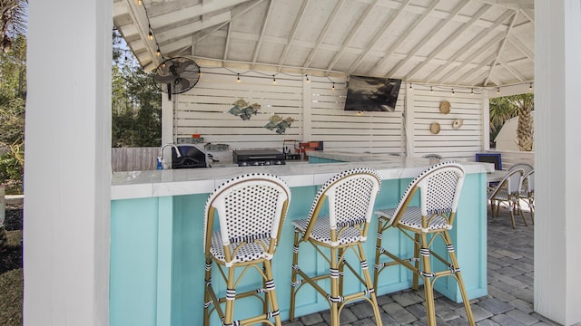 view of patio / terrace with a gazebo and an outdoor bar