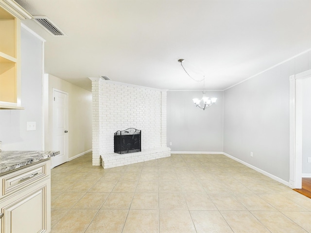 unfurnished living room featuring visible vents, an inviting chandelier, a brick fireplace, light tile patterned flooring, and baseboards