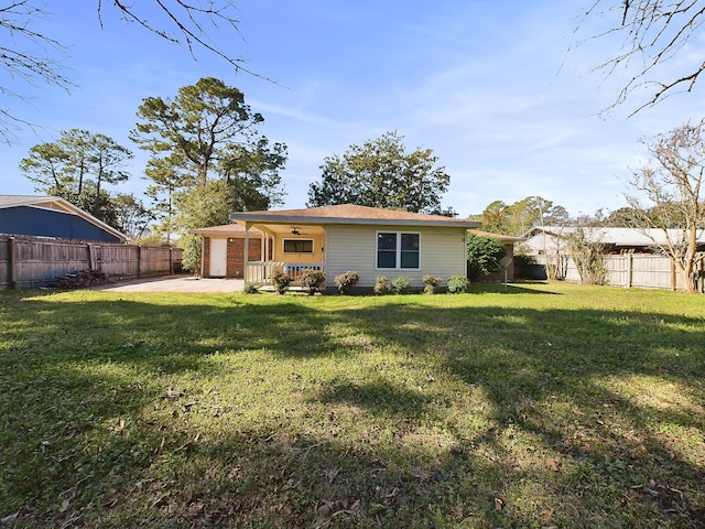 exterior space featuring a fenced backyard, a patio, and a yard