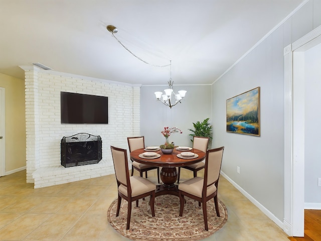 dining area with light tile patterned flooring, visible vents, baseboards, a brick fireplace, and crown molding