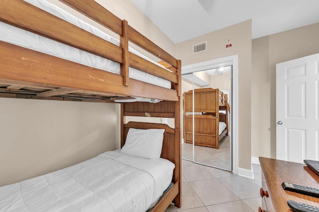 bedroom featuring light tile patterned floors