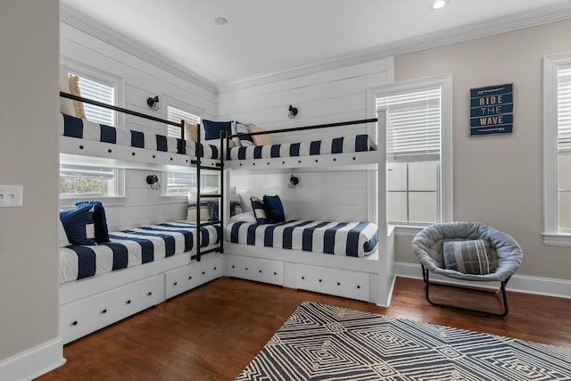 bedroom featuring ornamental molding and dark hardwood / wood-style flooring