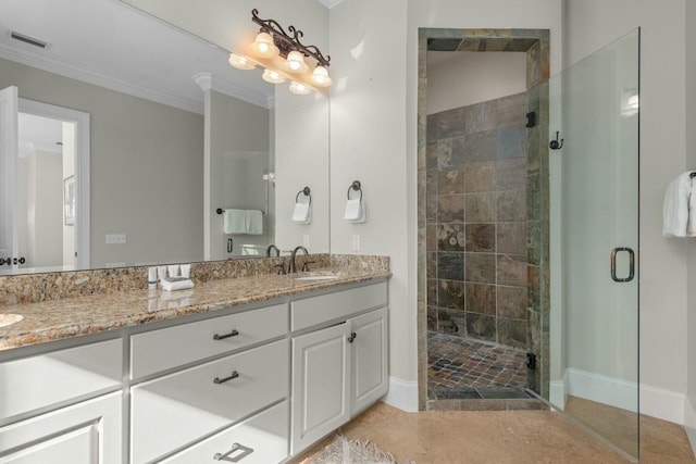 bathroom with tile patterned flooring, ornamental molding, an enclosed shower, and vanity