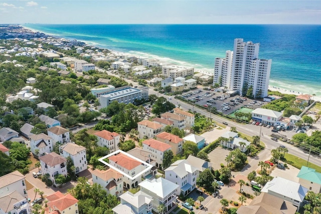 bird's eye view featuring a water view and a view of the beach