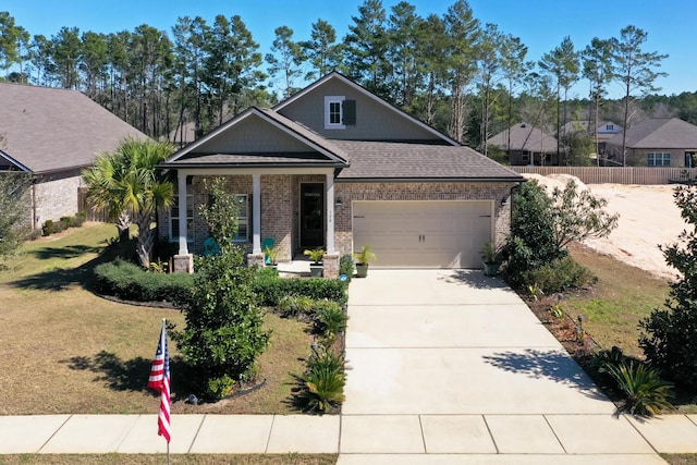 view of front of house with concrete driveway, roof with shingles, an attached garage, fence, and brick siding