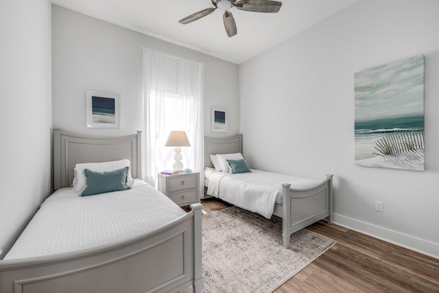 bedroom featuring dark wood-type flooring and ceiling fan