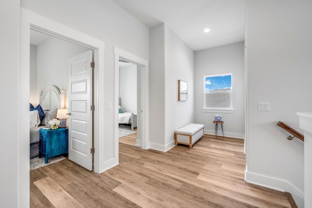 hall with light hardwood / wood-style floors