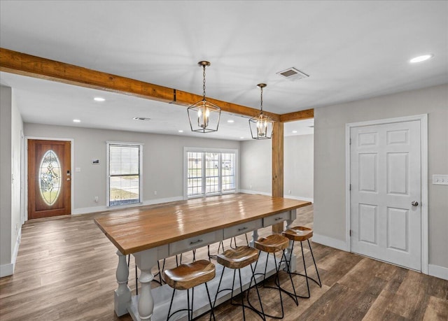 dining space with recessed lighting, dark wood-style flooring, visible vents, baseboards, and beamed ceiling