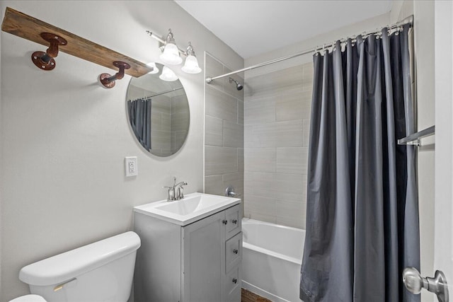 bathroom featuring shower / tub combo with curtain, vanity, and toilet