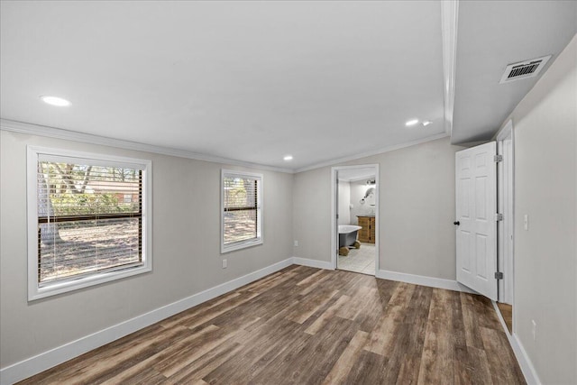 unfurnished bedroom with recessed lighting, wood finished floors, visible vents, baseboards, and crown molding