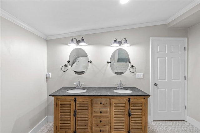 bathroom with double vanity, crown molding, baseboards, and a sink