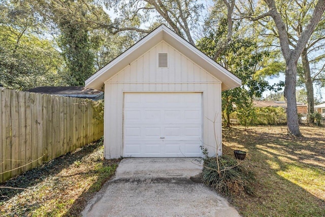 garage with fence