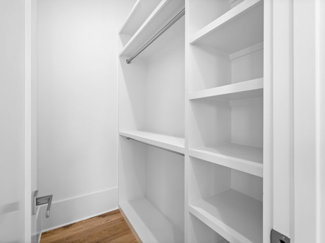 walk in closet featuring hardwood / wood-style floors