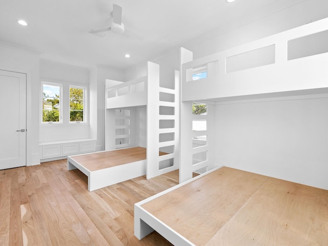 unfurnished bedroom featuring ceiling fan and light wood-type flooring