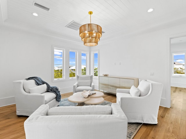 living room featuring wood ceiling and light hardwood / wood-style floors