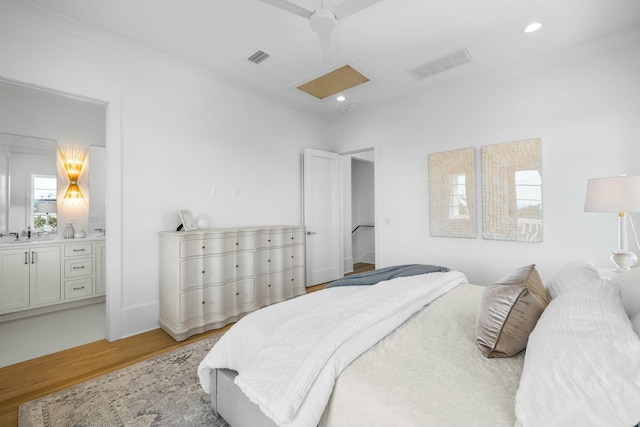 bedroom with crown molding, ceiling fan, sink, and light wood-type flooring