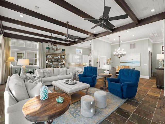 living room featuring beam ceiling and ceiling fan with notable chandelier