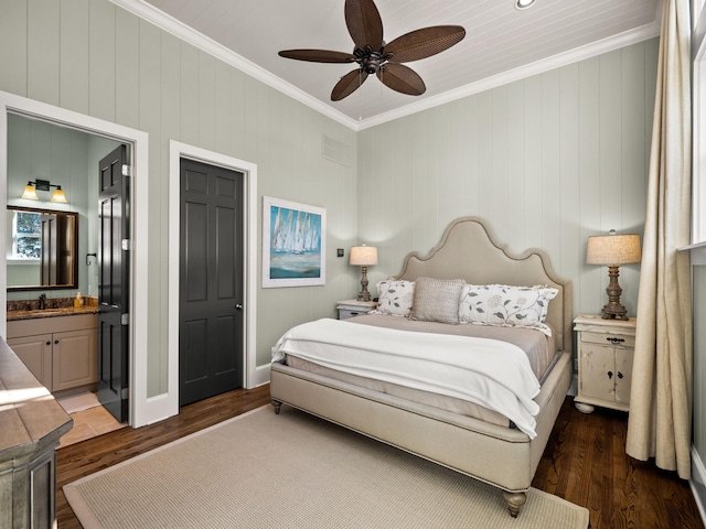 bedroom with sink, dark wood-type flooring, ceiling fan, ensuite bathroom, and ornamental molding