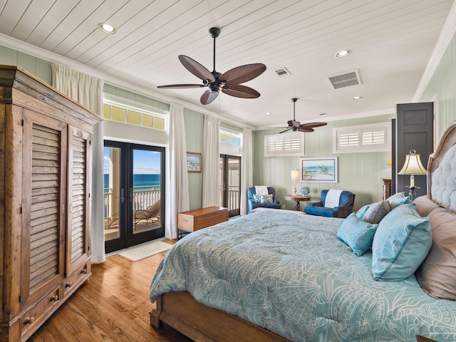 bedroom featuring access to outside, ceiling fan, crown molding, a water view, and french doors