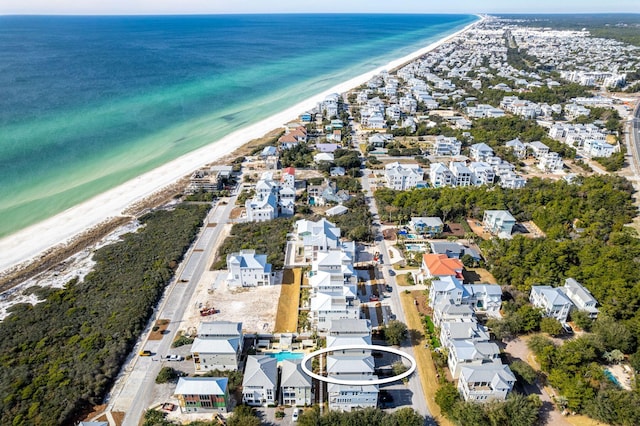 bird's eye view featuring a beach view and a water view