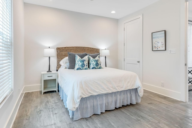 bedroom with hardwood / wood-style flooring