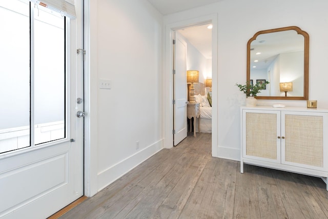 foyer entrance with light wood-type flooring