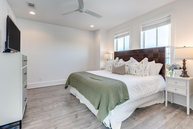 bedroom featuring ceiling fan and light wood-type flooring