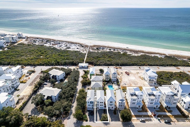 aerial view featuring a water view and a beach view