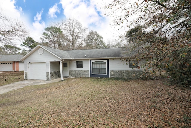 ranch-style house featuring a garage and a front yard