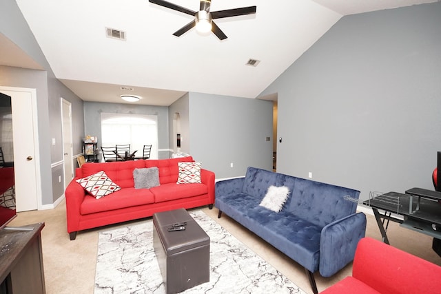 carpeted living room with high vaulted ceiling and ceiling fan