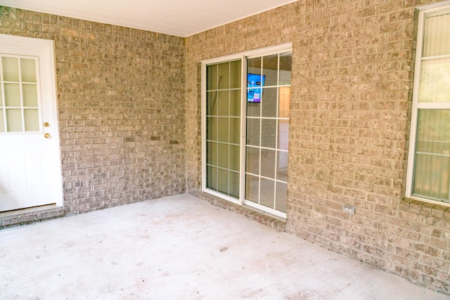 property entrance featuring a patio