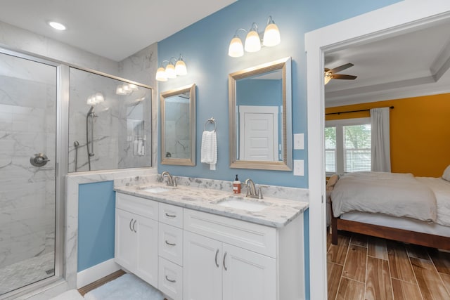 bathroom featuring ensuite bath, a marble finish shower, a sink, and wood finish floors