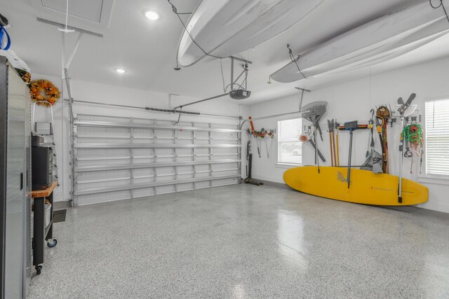 garage featuring baseboards and a garage door opener