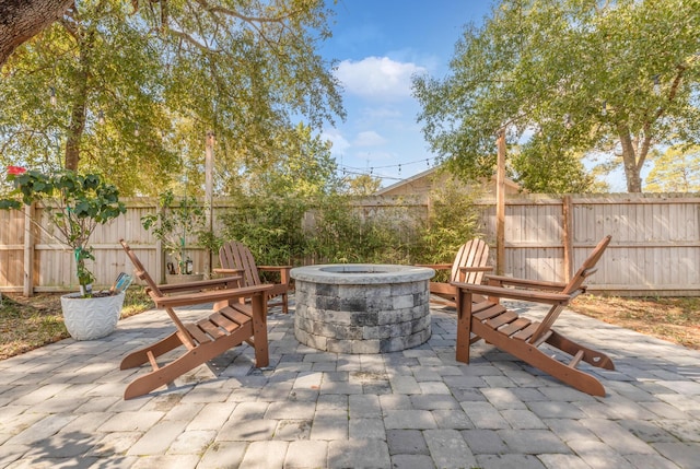 view of patio / terrace featuring a fire pit and a fenced backyard