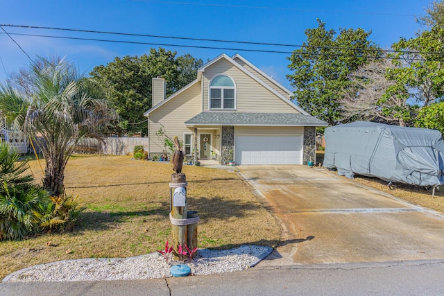 view of front of house with a garage and a front yard