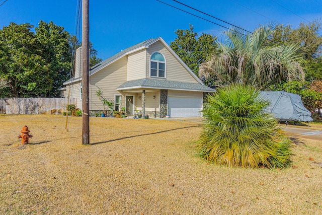 view of front of house featuring a garage and a front yard