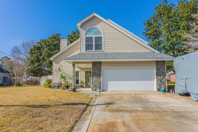 view of front facade featuring a garage and a front lawn