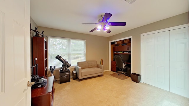 sitting room with light carpet and ceiling fan