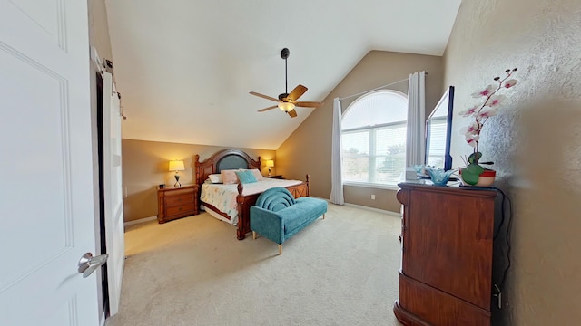 bedroom with ceiling fan, light colored carpet, and lofted ceiling