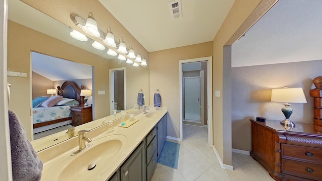 bathroom featuring tile patterned flooring and vanity