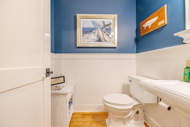 bathroom featuring toilet and hardwood / wood-style floors