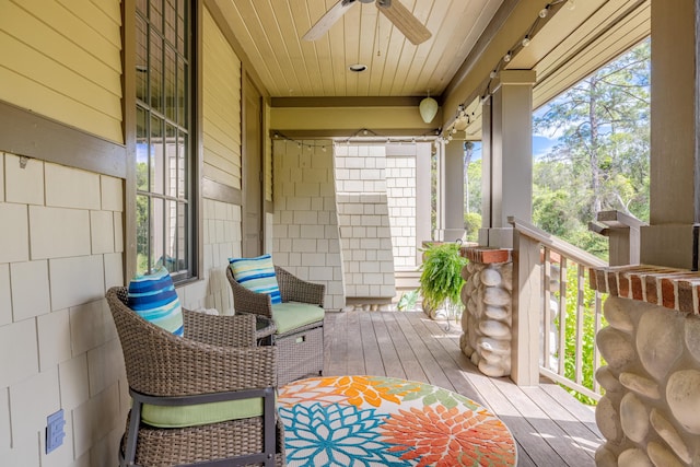 deck featuring ceiling fan and a porch