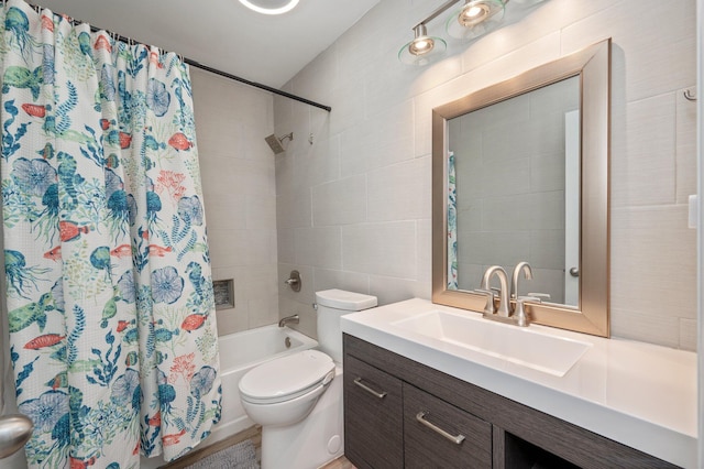 full bath with shower / bath combo with shower curtain, vanity, and toilet