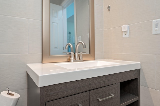 bathroom with tile walls and vanity