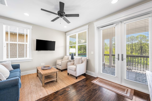 living room featuring hardwood / wood-style flooring, ceiling fan, and a healthy amount of sunlight