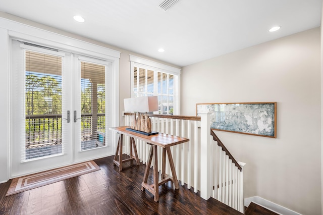 doorway with dark hardwood / wood-style floors and french doors