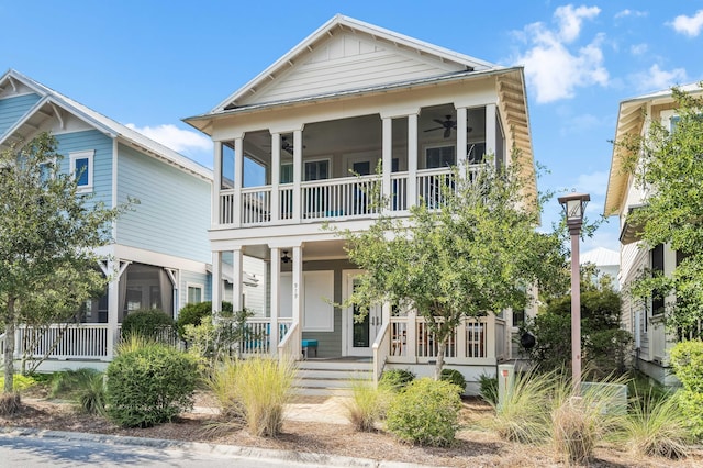 coastal inspired home with covered porch and ceiling fan