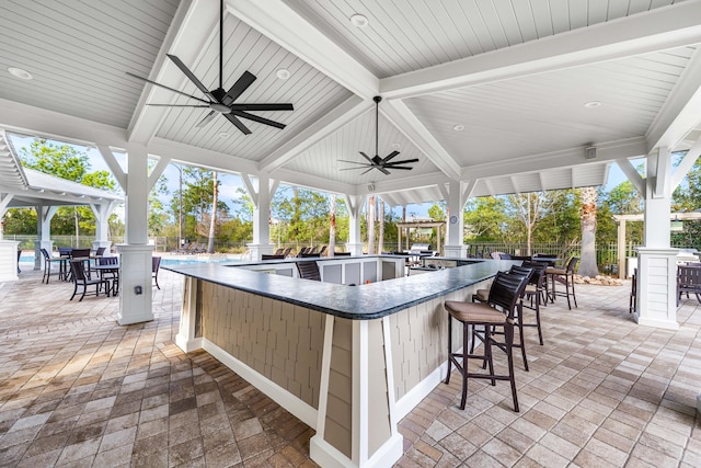 view of patio / terrace with a gazebo, an outdoor bar, and ceiling fan